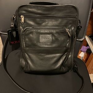 Tumi all leather messenger bag.